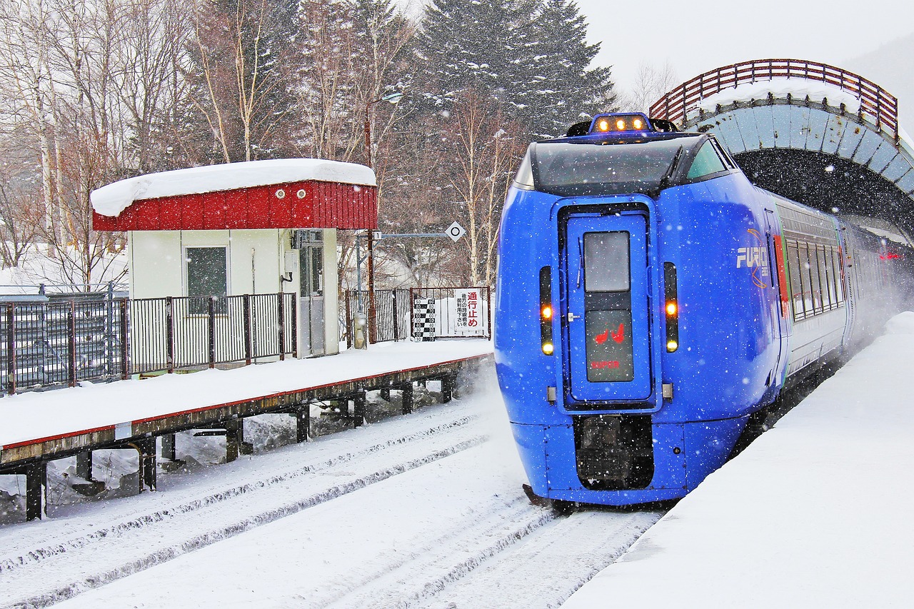 Train traveling through heavy snowfall in Hokkaido Japan