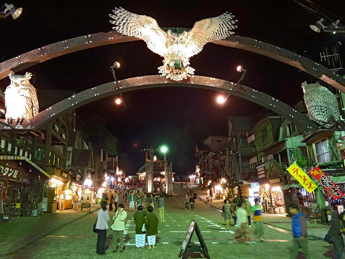 Main street of Ainu Kotan lined with souvenir shops selling Ainu handicrafts