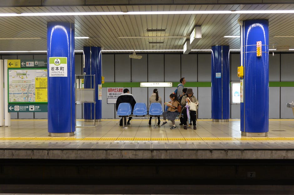 Metro station platform in Japan with waiting passengers