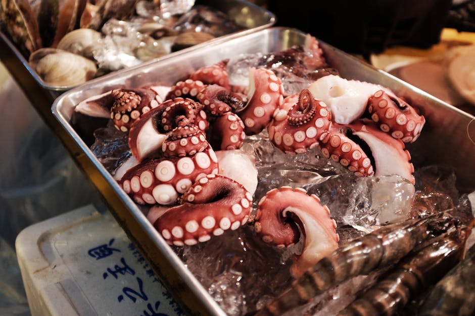Raw octopus tentacles on ice at a Japanese seafood market