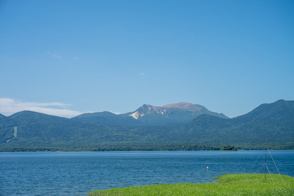 Clear blue waters of Lake Akan with mountains in the background in Hokkaido