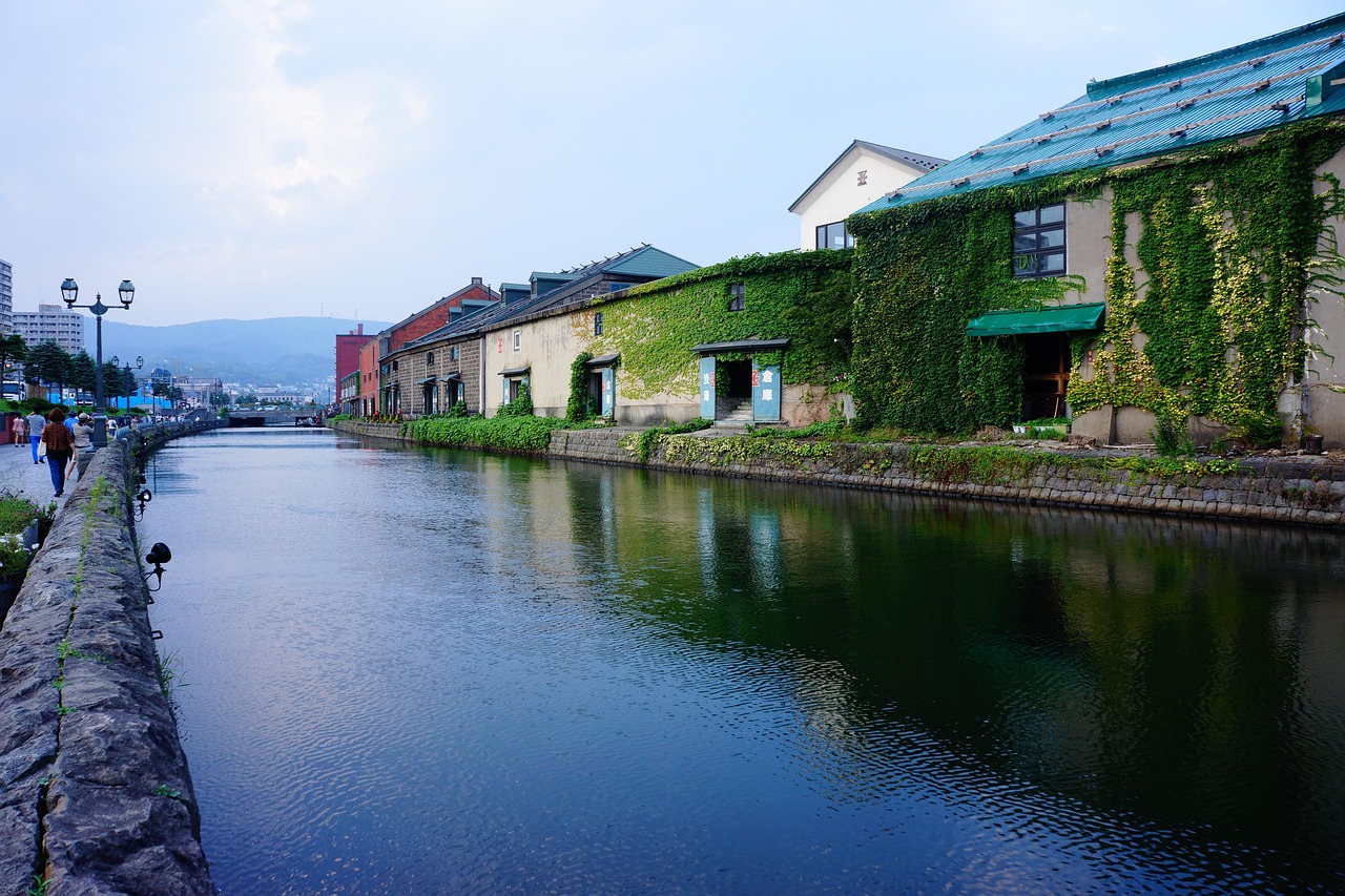Otaru Canal in Hokkaido with historic warehouses reflected in still water