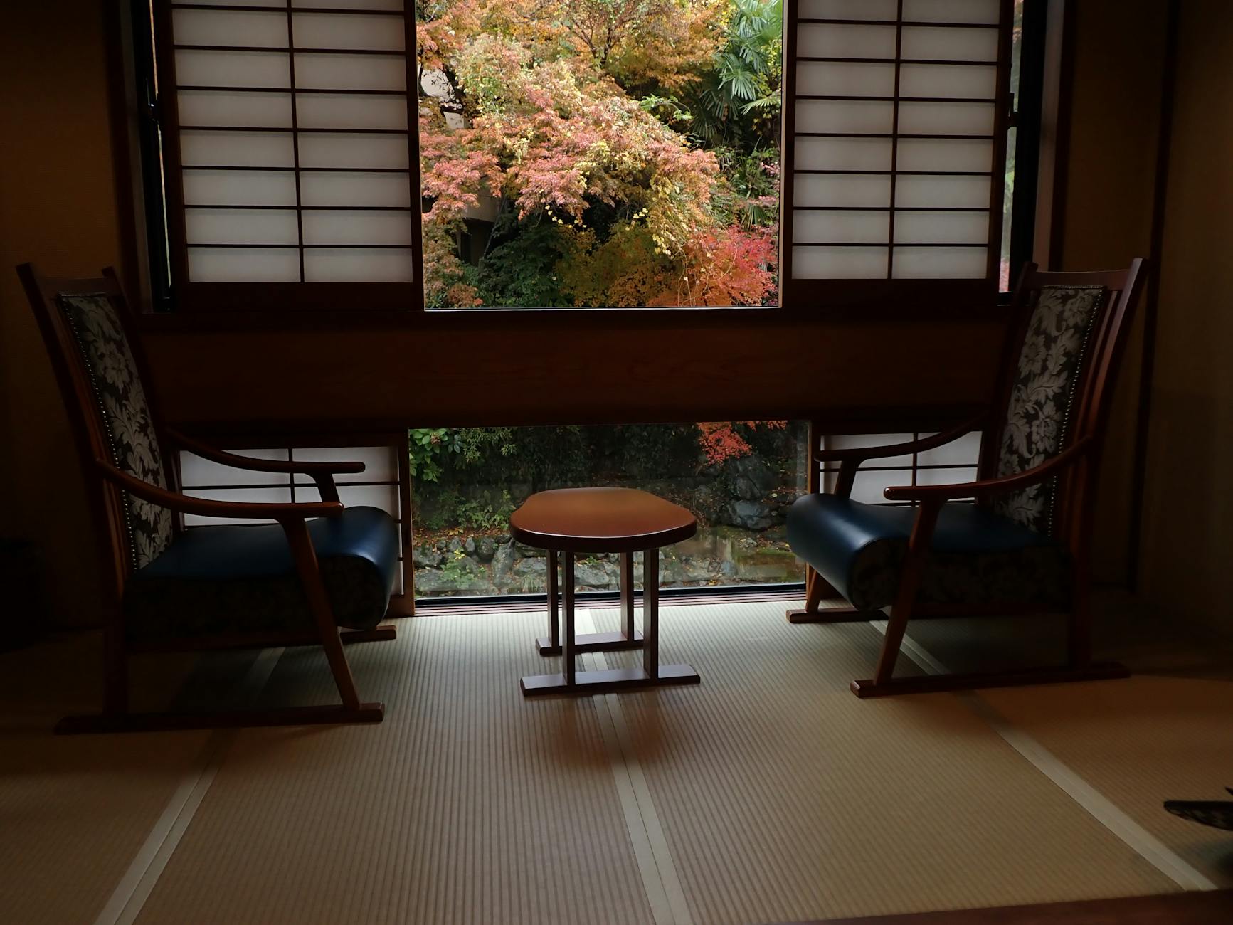 Traditional Japanese ryokan room with tatami floors and sliding doors