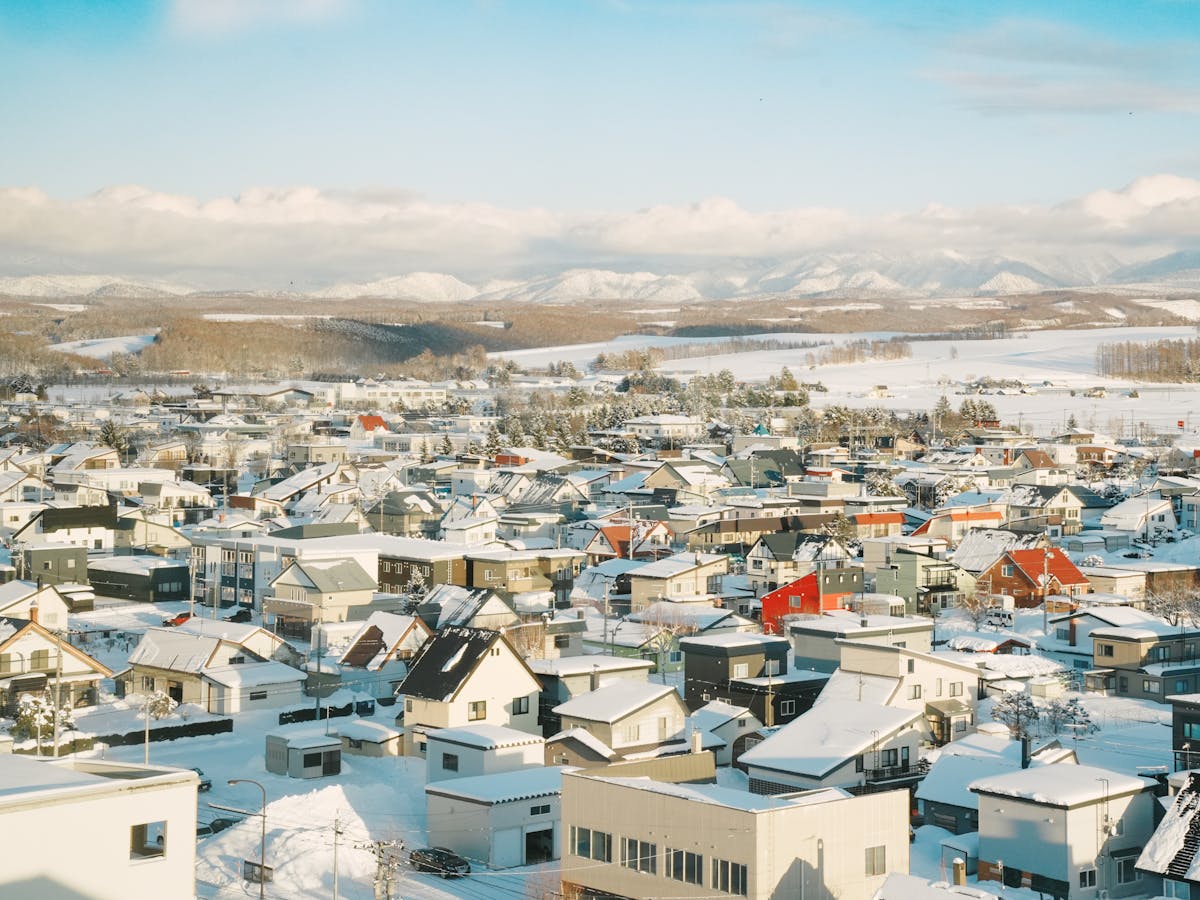 Aerial view of a snow-covered village in Hokkaido Japan winter landscape