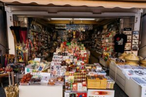 Vibrant market stall with diverse Japanese traditional items and souvenirs