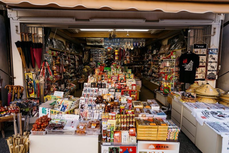 Vibrant market stall with diverse Japanese traditional items and souvenirs