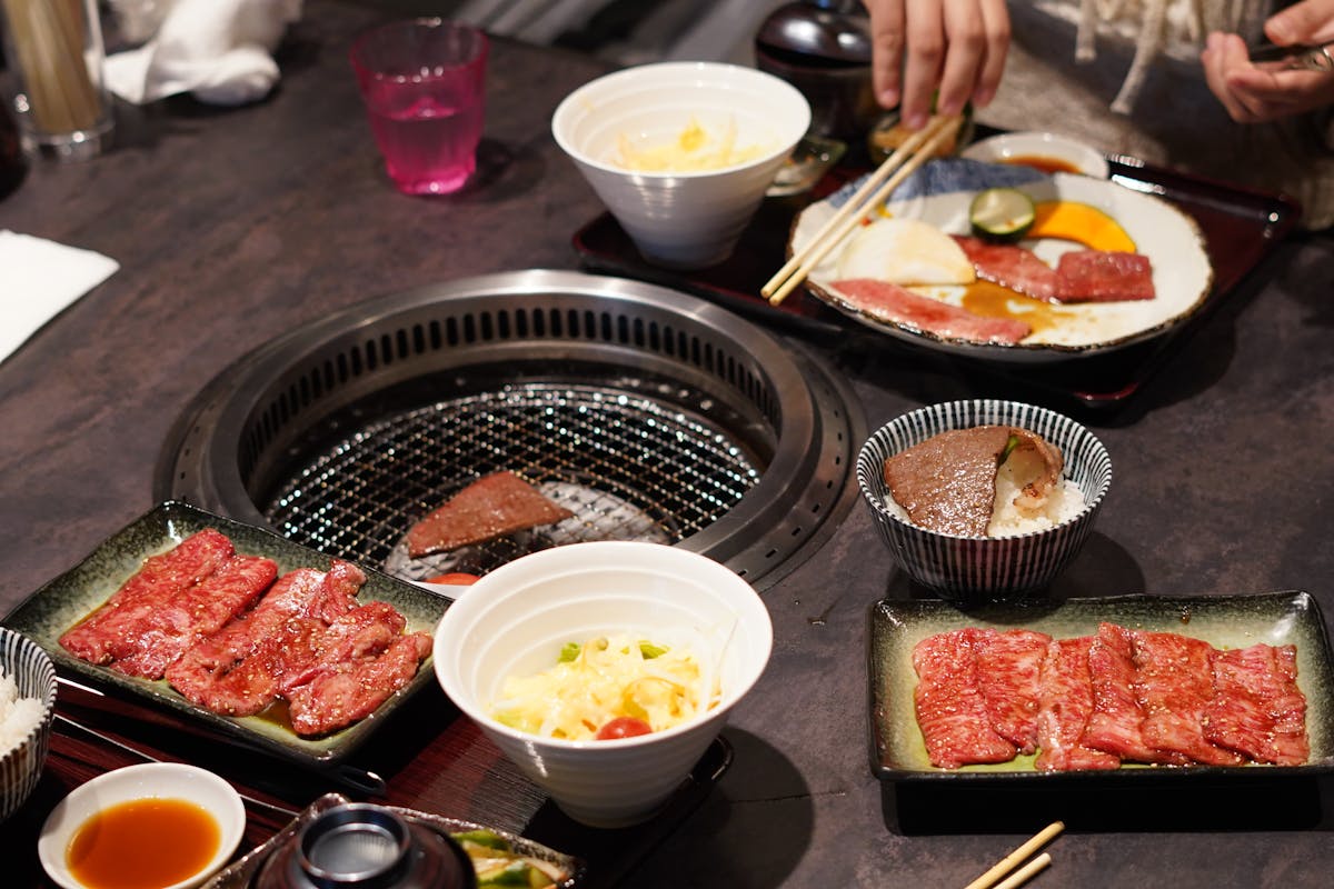 Japanese yakiniku meal with grilled meat and various side dishes