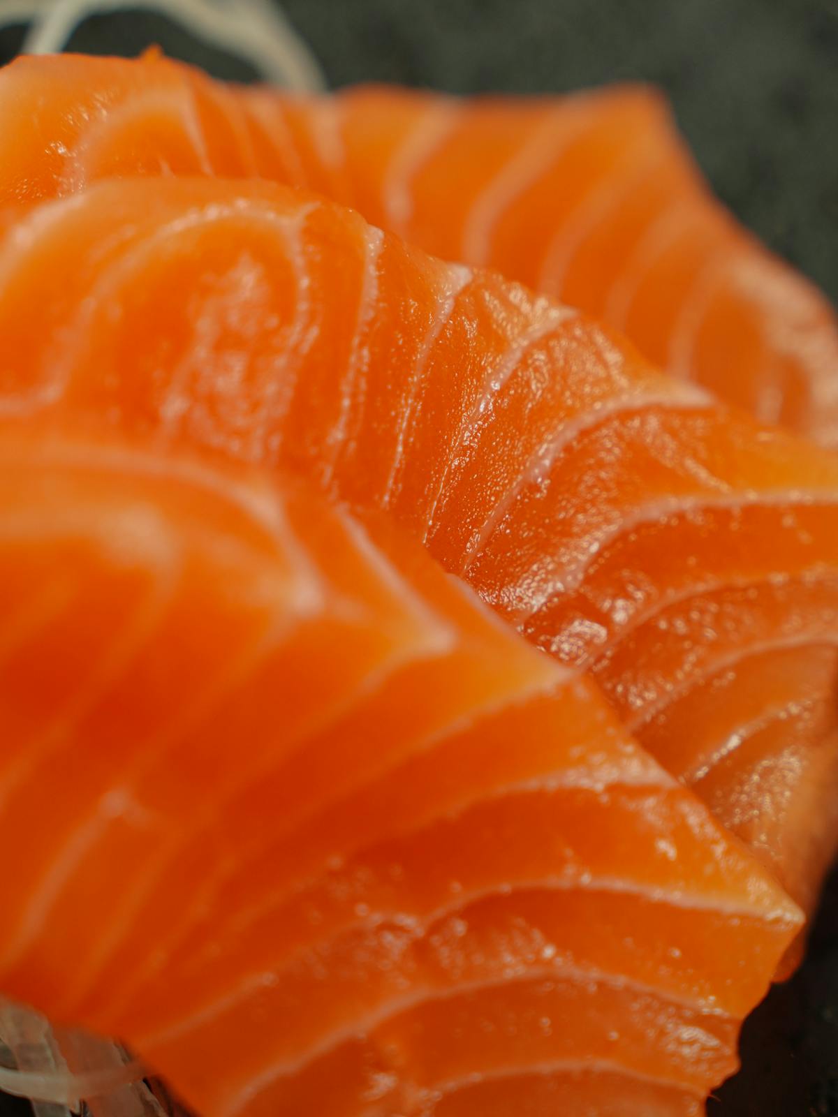 Close-up of fresh salmon sashimi, a local specialty at Lake Shikotsu