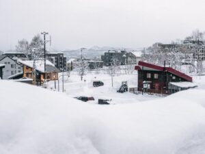 Serene winter scene of a tranquil village covered in snow in Niseko Hokkaido