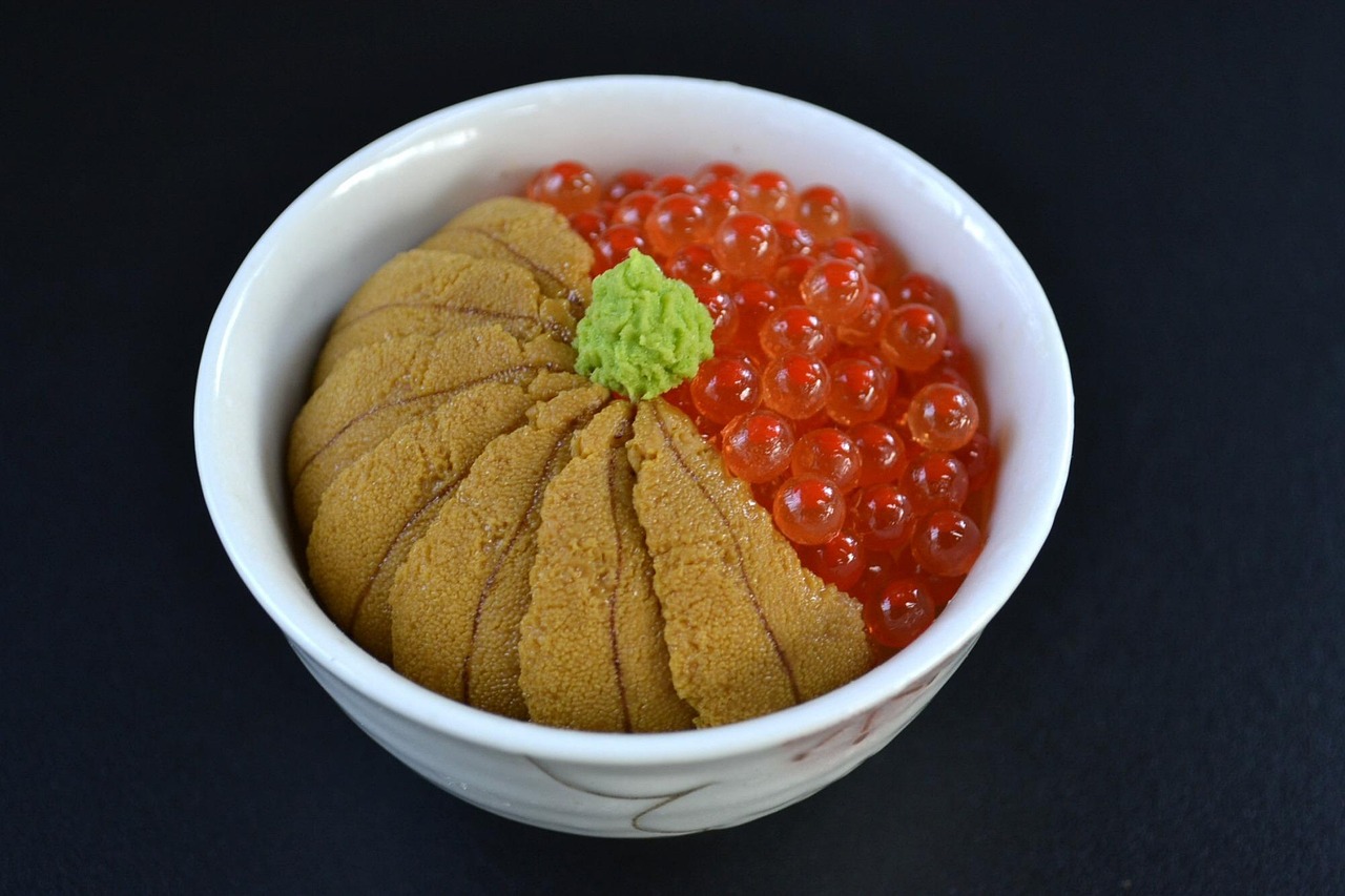 Fresh uni sea urchin and salmon roe served on a bowl of rice