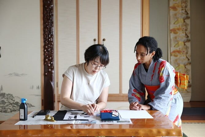 Calligraph Name in Japanese and Dress in Kimono - Getting dressed in kimono before the lesson